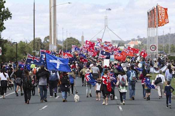 Protesters from the Convoy to Canberra march across Commonwealth Avenue Bridge towards the Parliamentary triangle in Canberra.