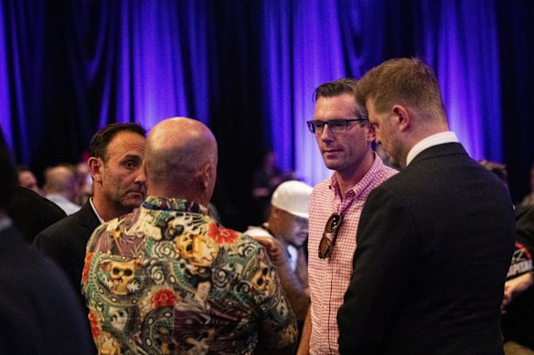 Chairman and Owner of the Sydney Kings Basketball Team Paul Smith speaks with NSW Treasurer Dominic Perrottet ahead of a Sydney Kings v Melbourne United NBL game at Qudos Bank Arena in Sydney.