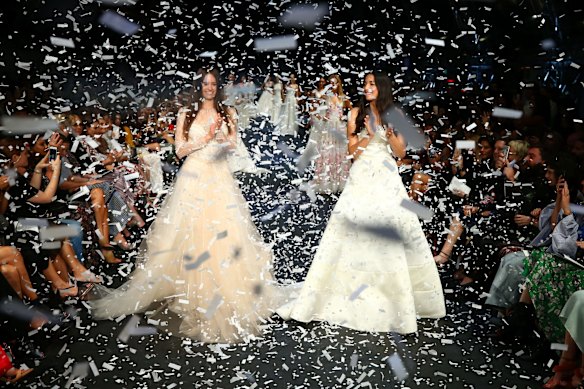 Jesinta Franklin and Jessica Gomes showcase designs during the finale on the runway at the David Jones Autumn Winter 2017 Collections Launch at St Mary's Cathedral Precinct, Sydney, on February 1, 2017.