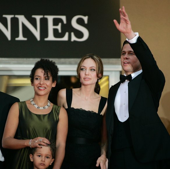 Mariane Pearl, wife of slain journalist Daniel Pearl, holds her son Adam as she arrives with Angelina Jolie, centre, and Brad Pitt for the screening of the film <em>A Mighty Heart</em>, at the 60th International film festival in Cannes in 2007. 