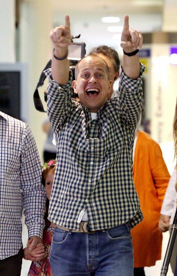 Australian journalist Peter Greste reacts upon his return home at Brisbane.