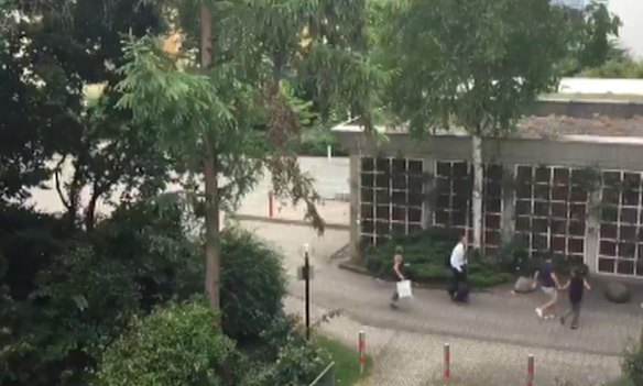 In this frame grab taken from video, people run from the Olympia Einkaufszentrum shopping centre.