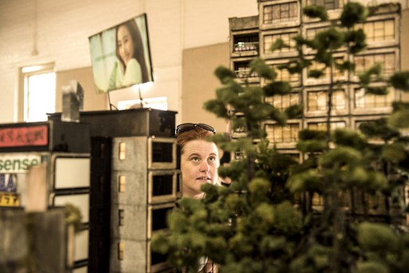 Suzette Meade from Parramatta looking at an artist's sculpture of the Sirius building on May 9, 2019. 