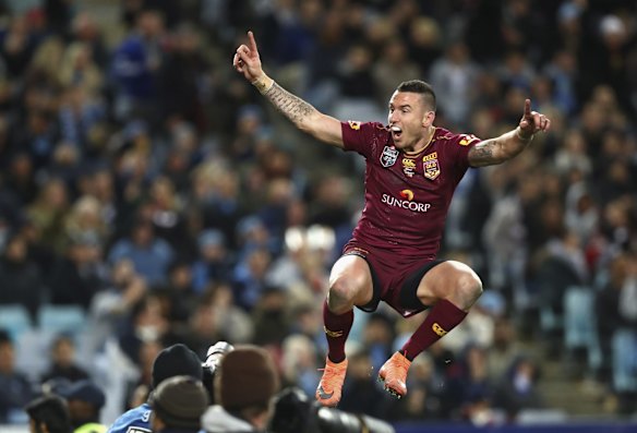 Darius Boyd of the Maroons celebrates after scoring a try.