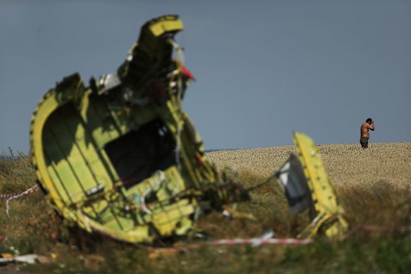 Our driver Dima stands in the field where he came across a divers watch near the rear fuselage debris from the MH17 plane crash outside the village of Grabovka in the self proclaimed Donetsk Republic, Ukraine. 2nd August, 2014. Photo: Kate Geraghty