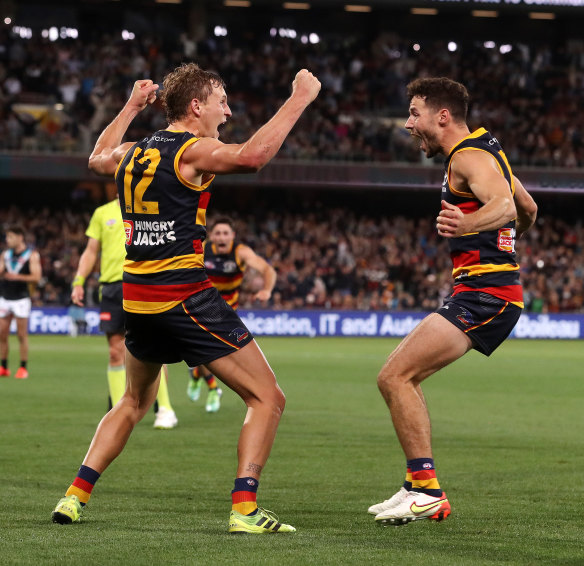 Sheer joy: Players begin to surround Jordan Dawson after his winning kick.