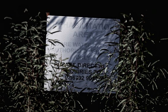 Worn sign marking the site of a serious CSG salt water spill in the Pilliga State Forest which has since been rehabilitated after SANTOS took over the site.