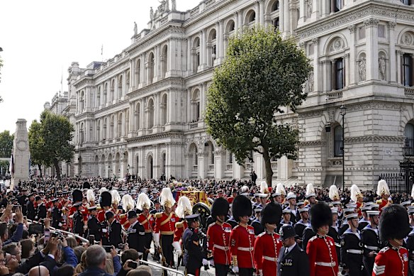 The coffin of Queen Elizabeth II is pulled on a gun carriage through the streets of London.