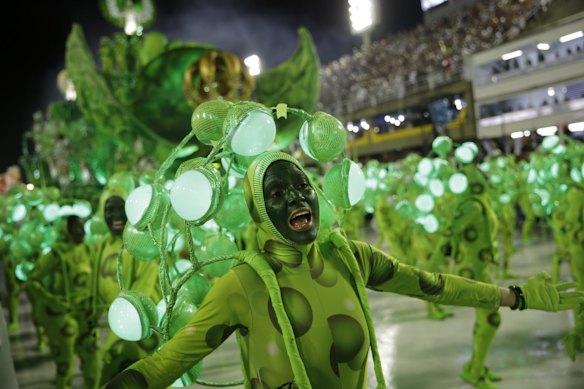 Performers from the Imperio Serrano samba school parade during Carnival celebrations at the sambadrome in Rio de Janeiro.
