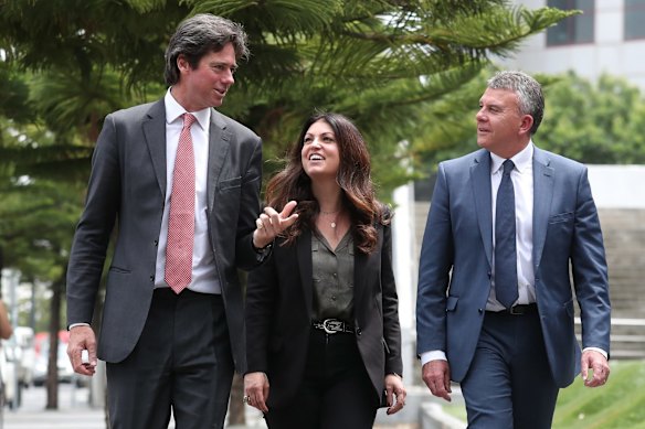 Gillon McLachlan, Chief Executive Officer of the AFL, Dr Kate Hall, AFL Head of Mental Health and Wellbeing and Lifeline Australia Chief Executive Officer Colin Seery chat after an AFL press conference announcing a mental health partnership with Liefline at AFL House 2019
