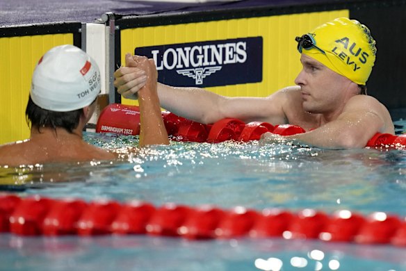 Matthew Levy of Australia, right, shakes hands with Wei Soong Toh of Singapore after winning the gold medal in the Men's 50 meters freestyle S7 final.