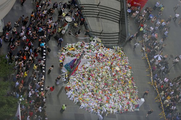 Thousands of bouquets of flowers in Martin Place, as seen from above.