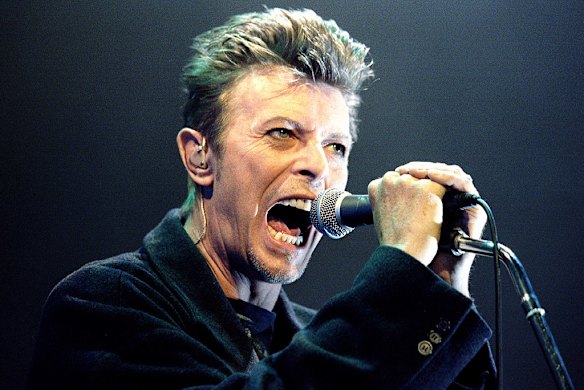 Bowie performs during a concert in Vienna in 1996.