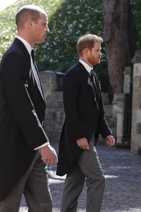 Prince William, left, and Prince Harry follow the coffin in a ceremonial procession.