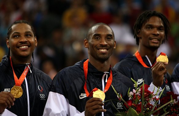 2008: Kobe Bryant stands on the podium with his gold medal after the United States defeated Spain in the at the Beijing 2008 Olympic Games.