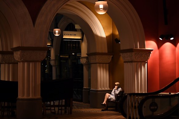 A sole person in an empty Queen Victoria Building, Sydney.