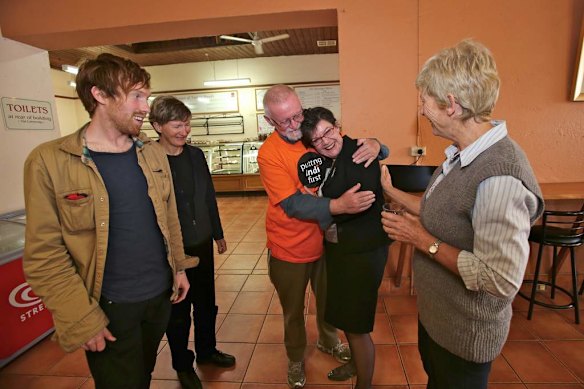 Cathy celebrates her win with locals at the Chiltern Bakery.