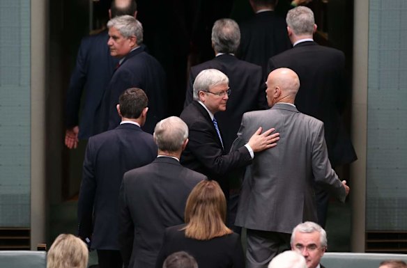 Kevin Rudd passes Warren Snowdon after a divison on Government changes to immigration visa subclass 457 at Parliament House.