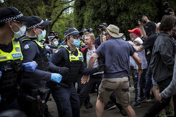 Police clash with protesters at the Shrine.
