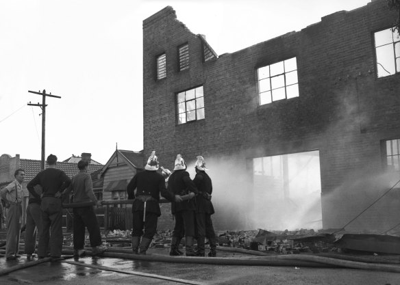 Firemen battle a fire at the Best and Butler Tannery in Botany on June 9, 1952.