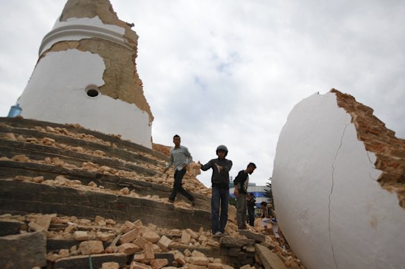 Volunteers work to remove debris at the historic Dharahara tower, a city landmark, after an earthquake in Kathmandu, Nepal.