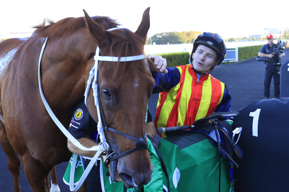   James McDonald gives Nature Strip a pat after winning the TJ Smith Stakes.  