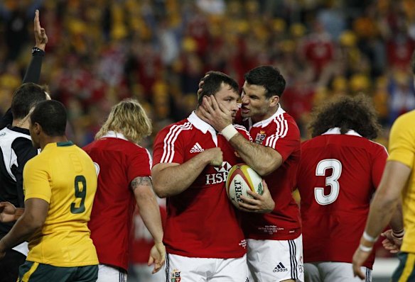 Alex Corbisiero embraced by team mates after scoring opening try.