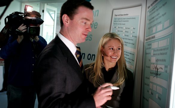 Parliamentary Secretary to the Minister for Health and Ageing Christopher Pyne with former Winter Olympic Gold Medal winner Alisa Camplin signing a Organ donation form. 11th September 2006.