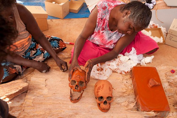 July 19th 2011,  Donna Nadjamerrek prepares a womans skull for ceremony, as human remains are finally reurned to their ancestral home in Gunbalanya for reburial after over 60 years in the posession of the Smithsonian Institution after being collected during a combined Australian and American expedition to Arnhem Land in 1948.