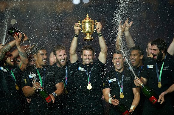 Champions: Richie McCaw  lifts the Webb Ellis Cup 