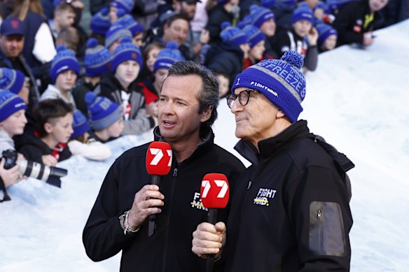 Hamish McLachlan and Tim Watson are seen during the Big FightMND Freeze 8, during the round 13 AFL match between the Collingwood Magpies and the Melbourne Demons at Melbourne Cricket Ground.