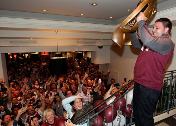Manly Sea Eagle George Rose shows the NRL Premiership trophy to the Manly fans at the Manly Leagues Club after defeating the New Zealand Warriors in the 2011 Grand Final. 2nd October 2011 Photo: Janie Barrett