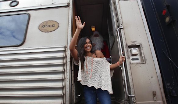 Jessica Mauboy waves goodbye as she boards the Indian Pacific train after performing at Watson on The Nullabor Plain in South Australia for children from Oak Valley Aboriginal School. The concert in Watson is the highlight of many performances across Australia on the Indian Pacific Outback Christmas Train.