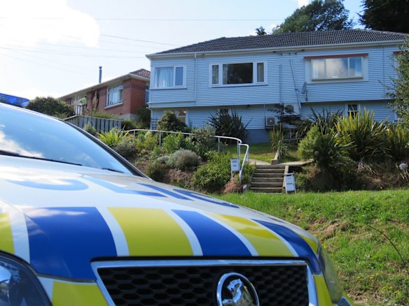 New Zealand police at the suspected gunman's house in Dunedin. 
