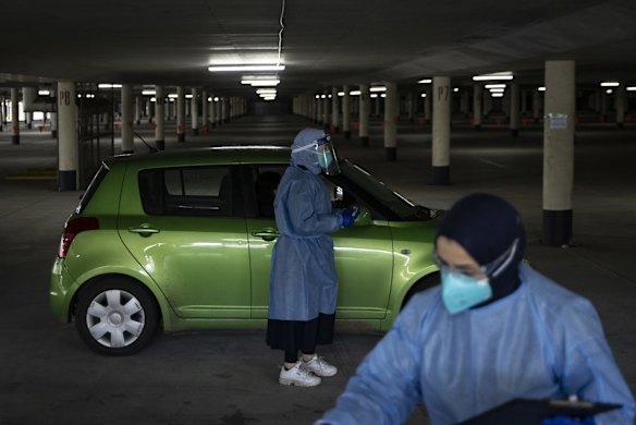 COVID-19 testing is carried out at the underground carpark at Marconi Stadium, Restwell Road, Bossley Park, as tighter lockdown restrictions are announced for Greater Sydney.