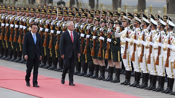 Malcolm Turnbull, with Premier Li Keqiang, receives a ceremonial welcome at the Great Hall of the People in Beijing.