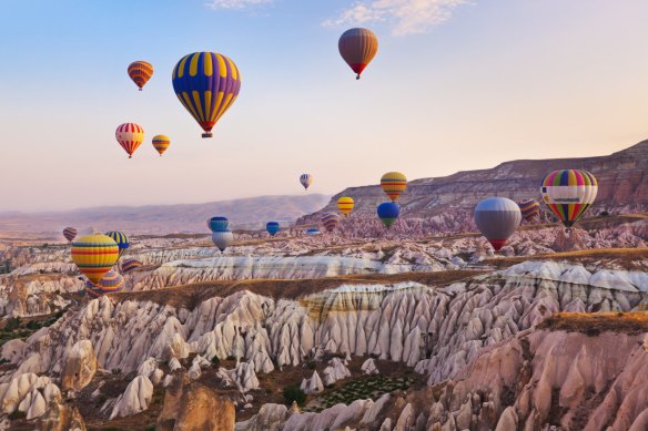 Hot air balloons flying over  Cappadocia.