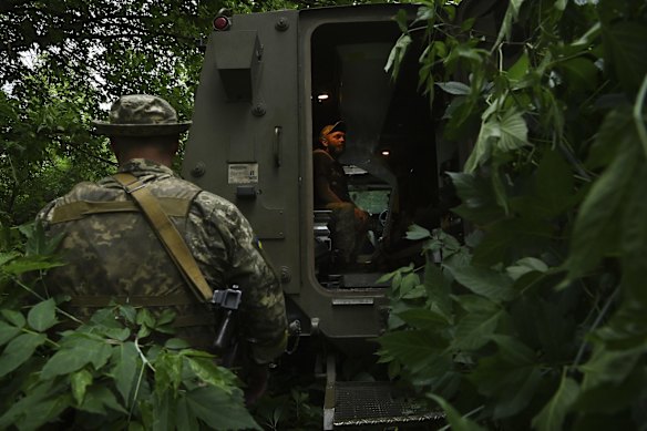 Ukrainian gunner Stepan takes a seat in the back of the vehicle.