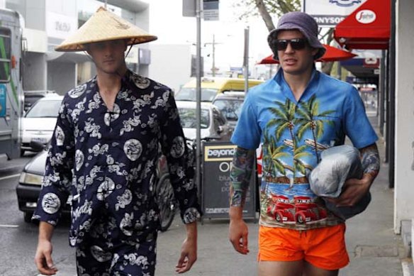 Collingwood footballers Alan Toovey (left) and Luke Ball arrive at the Rising Sun Hotel in Richmond in costume for the club's Mad Monday celebrations after the Magpies won their first Premiership in 20 years. 