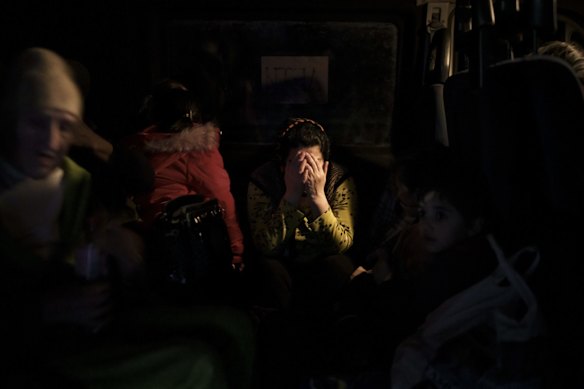 A woman reacts as she arrives from Mariupol to a refugee centre in Zaporizhia, Ukraine.