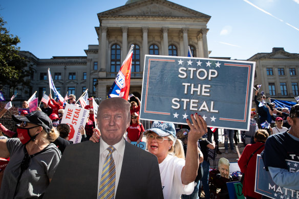 Demonstrators gather during a "Stop The Steal" rally outside of the Georgia State Capitol in Atlanta on Saturday.