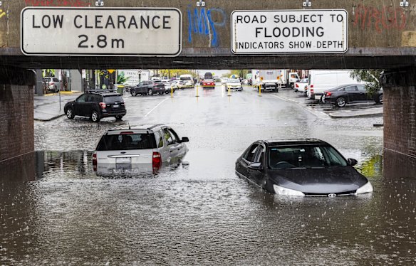 Cars lie submerged in floodwater on the York Street underpass in South Melbourne after flash flooding hit the city.