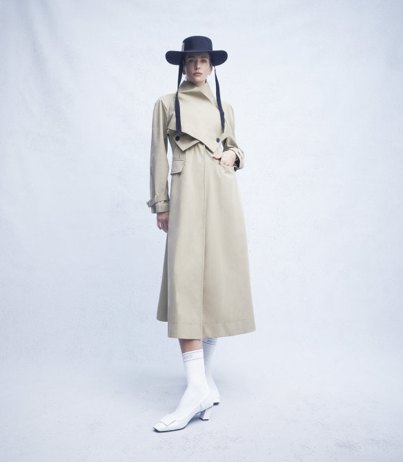Dior trench coat, $6900. Roger Vivier “Très Vivier” hat, $1210, and “Belle Vivier” boots, $2590.   