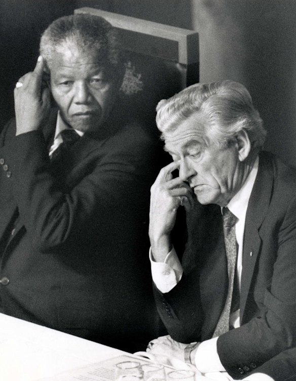Nelson Mandela with Prime Minister Bob Hawke at a press conference in Canberra during Mandela's Australian visit. 1990.