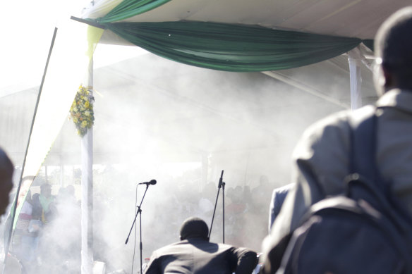 Smoke fills the stage at the rally.