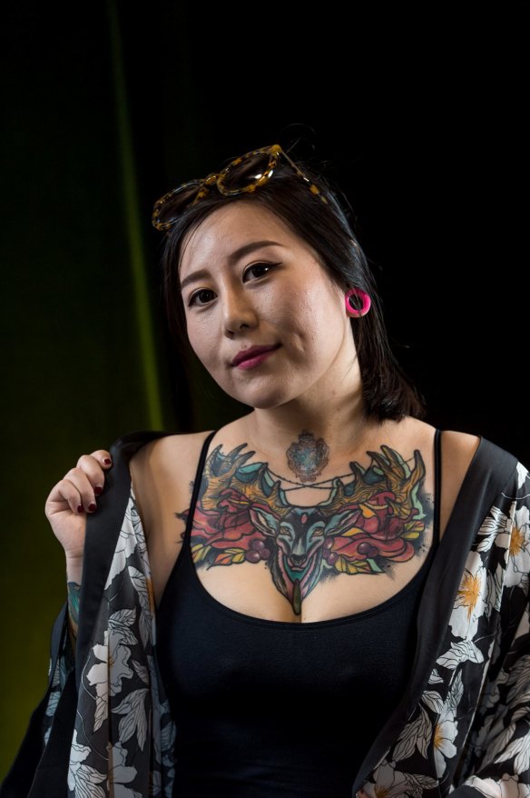 The Age, News 18/11/2016, picture by Justin McManus. Tattoo Convention at the Melbourne Exhibtion centre. People and their favorite tattoo. Ludan Jiang and tatto of her cat.