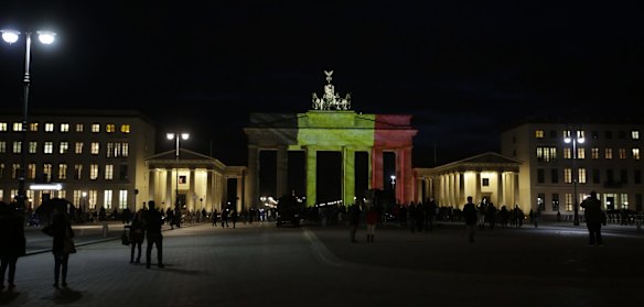The Brandenburg Gate is illuminated with the Belgian national flag.