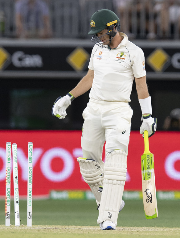 Australian captain Tim Paine looks at his stumps after being bowled by New Zealand's Tim Southee. 