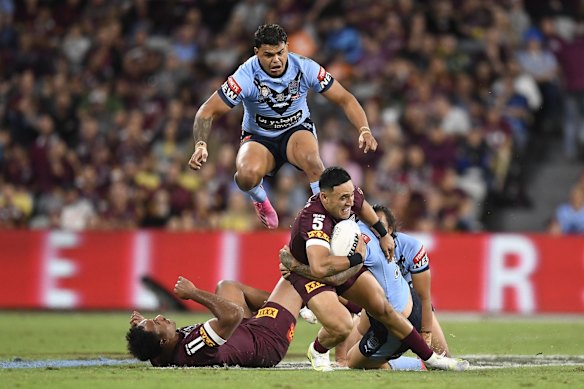 Valentine Holmes of the Maroons is tackled during game one of the 2021 State of Origin series.