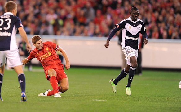 Liverpool's Steven Gerrard kicks the opening goal at the MCG.